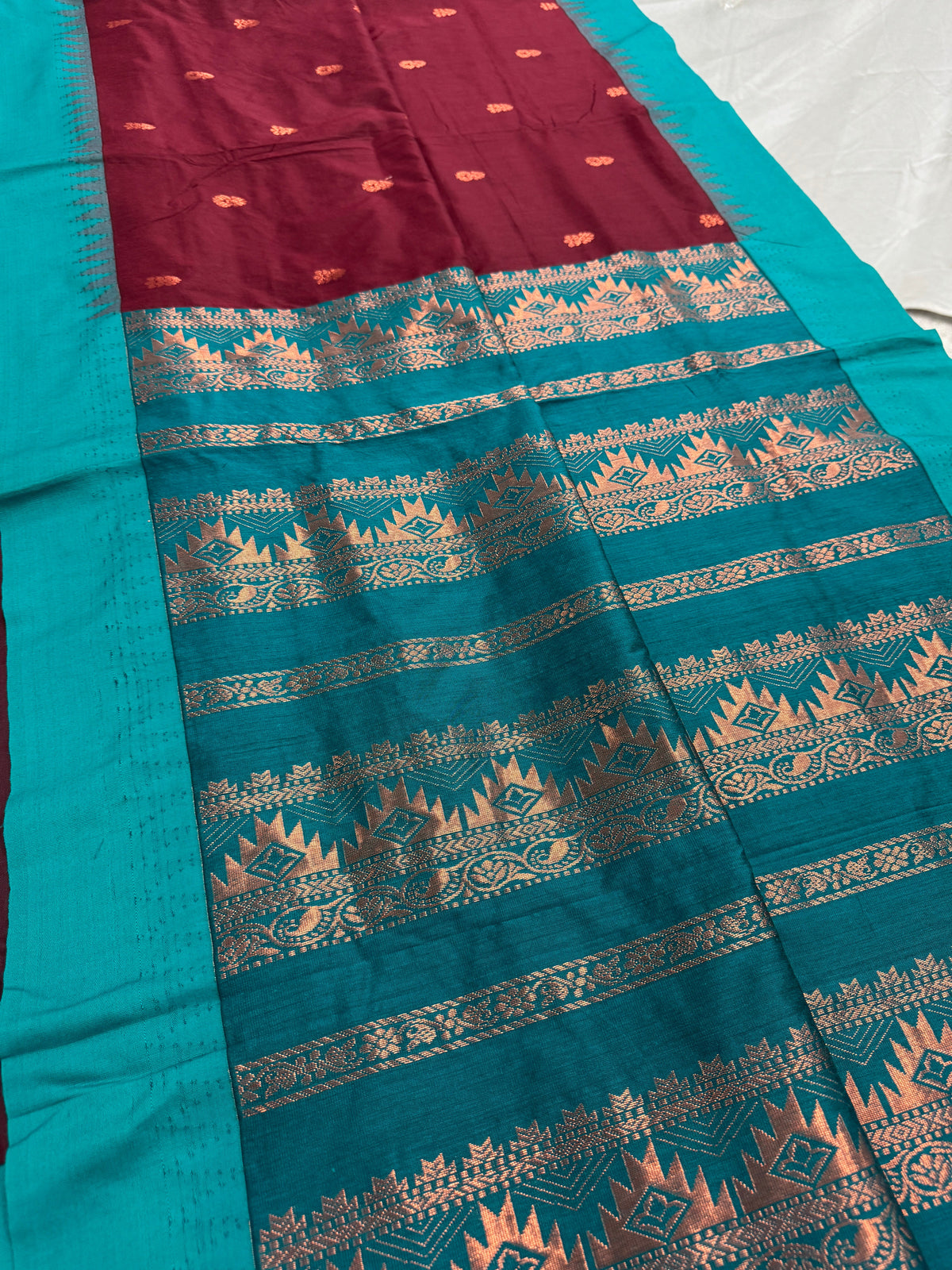 Pritha: Dark Brown and Sea Green Blended Cotton Gadwal Saree.