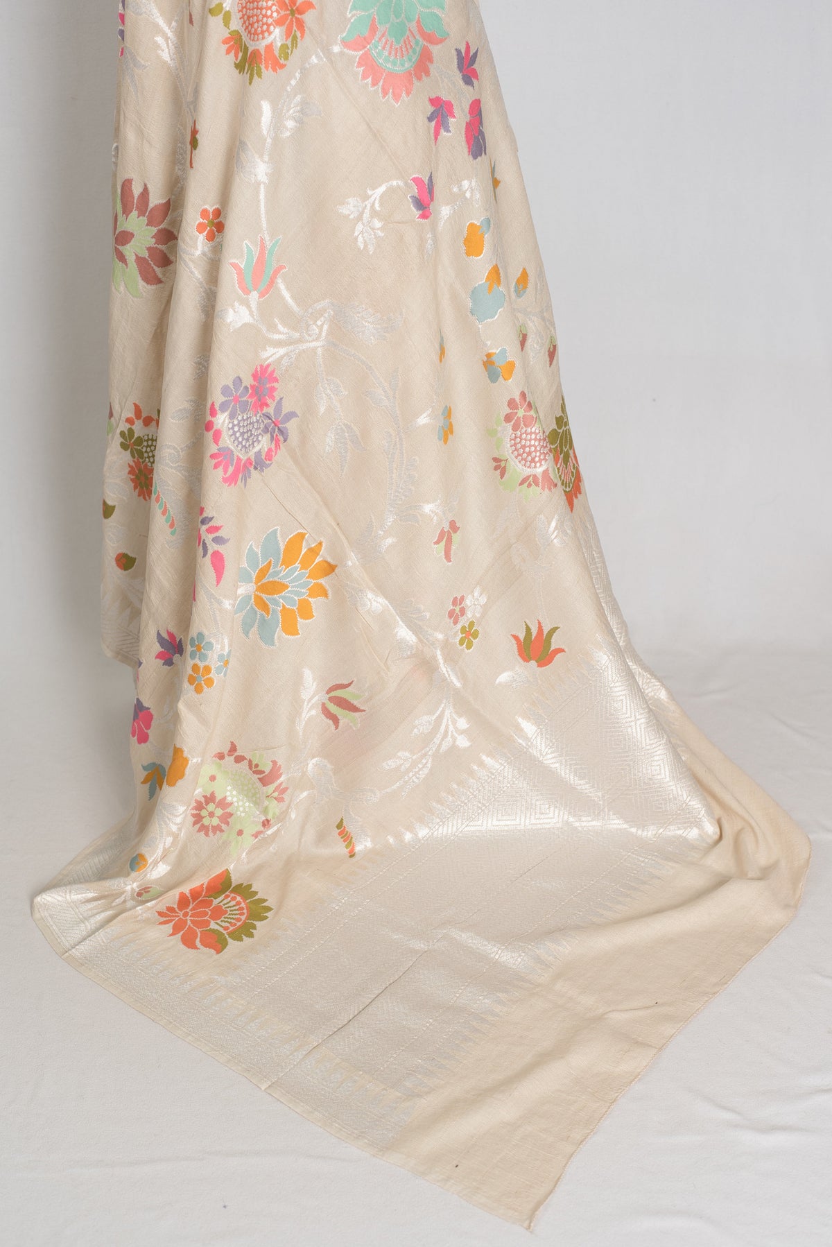 Nidhi : Beige & Silver Tussar Georgette Banarasi Saree with Minakari Florals