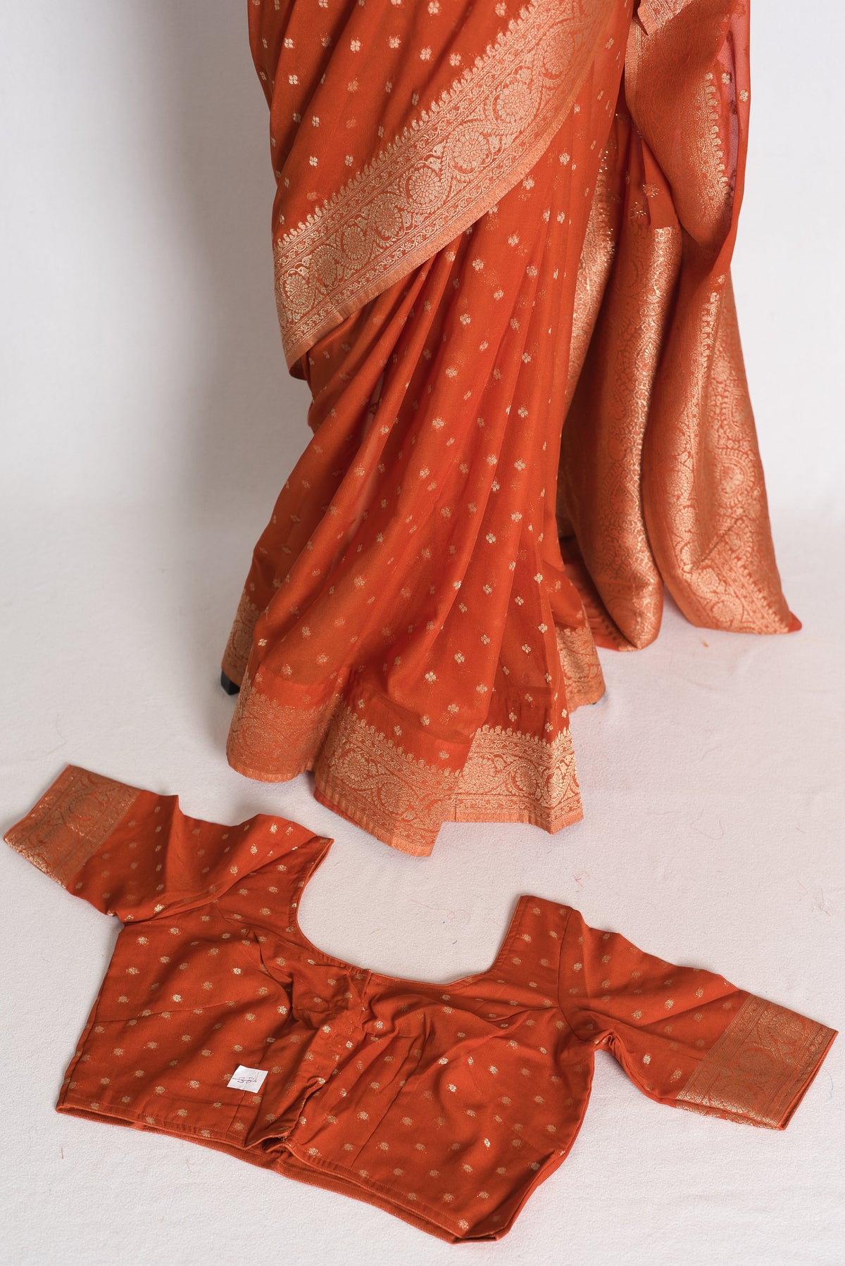Mahi: Rust Brown Lightweight Semi Georgette Banarasi Saree with 38 Size Blouse