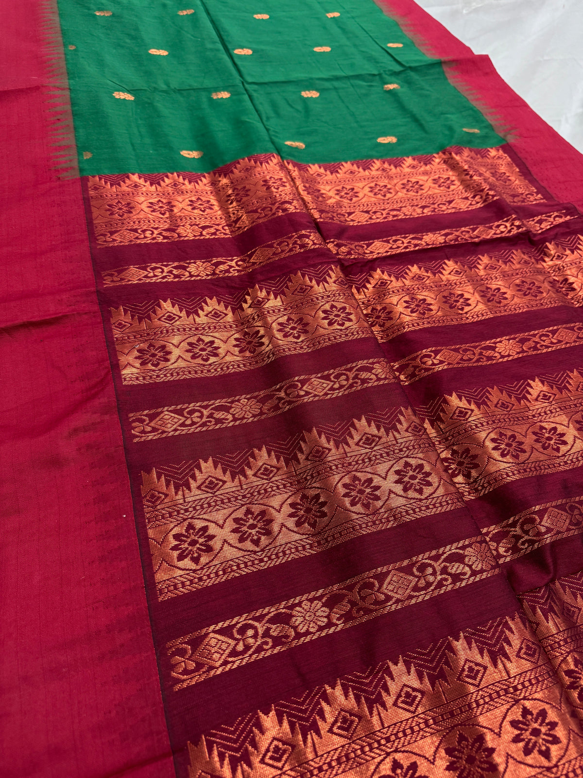 Gayetri: Dark Green Blended Cotton Gadwal Saree with Antique Zari Butis