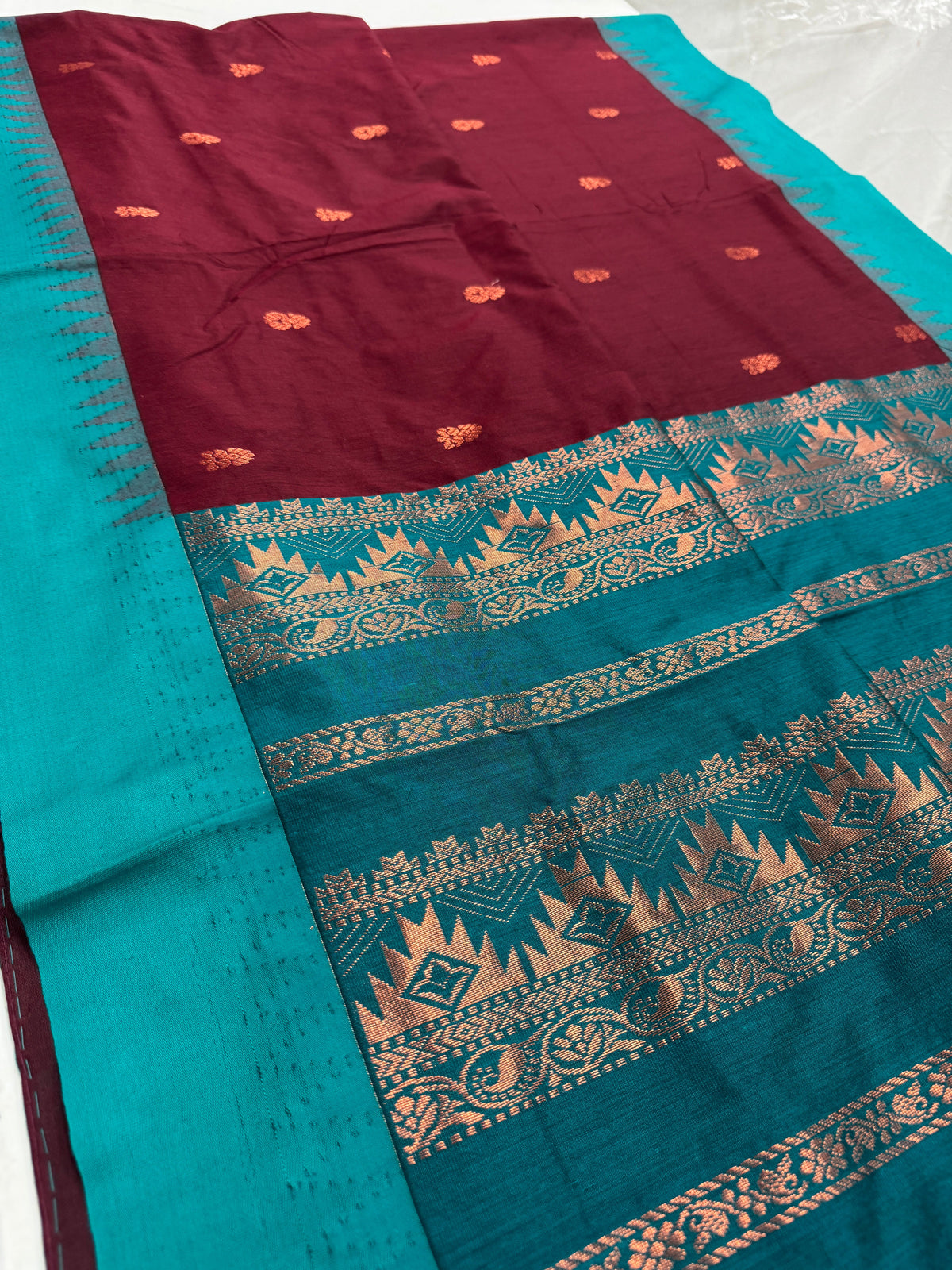 Pritha: Dark Brown and Sea Green Blended Cotton Gadwal Saree.