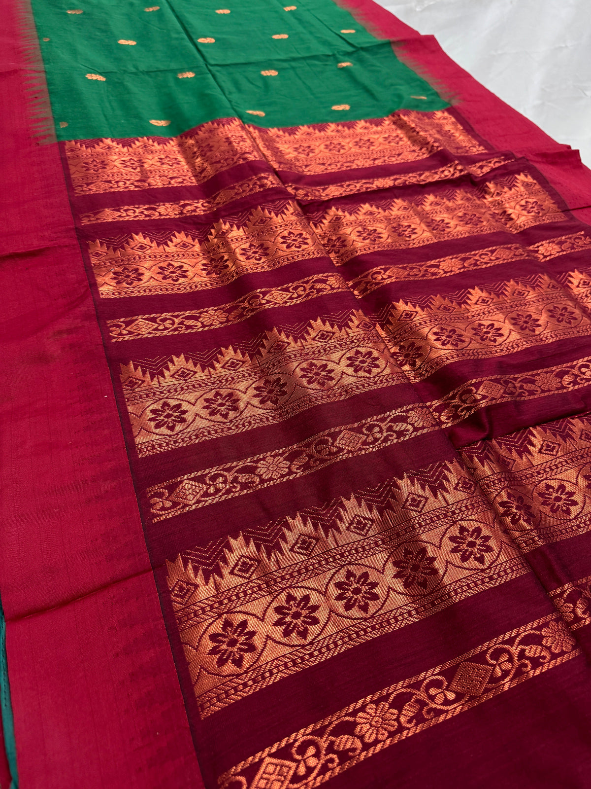 Gayetri: Dark Green Blended Cotton Gadwal Saree with Antique Zari Butis