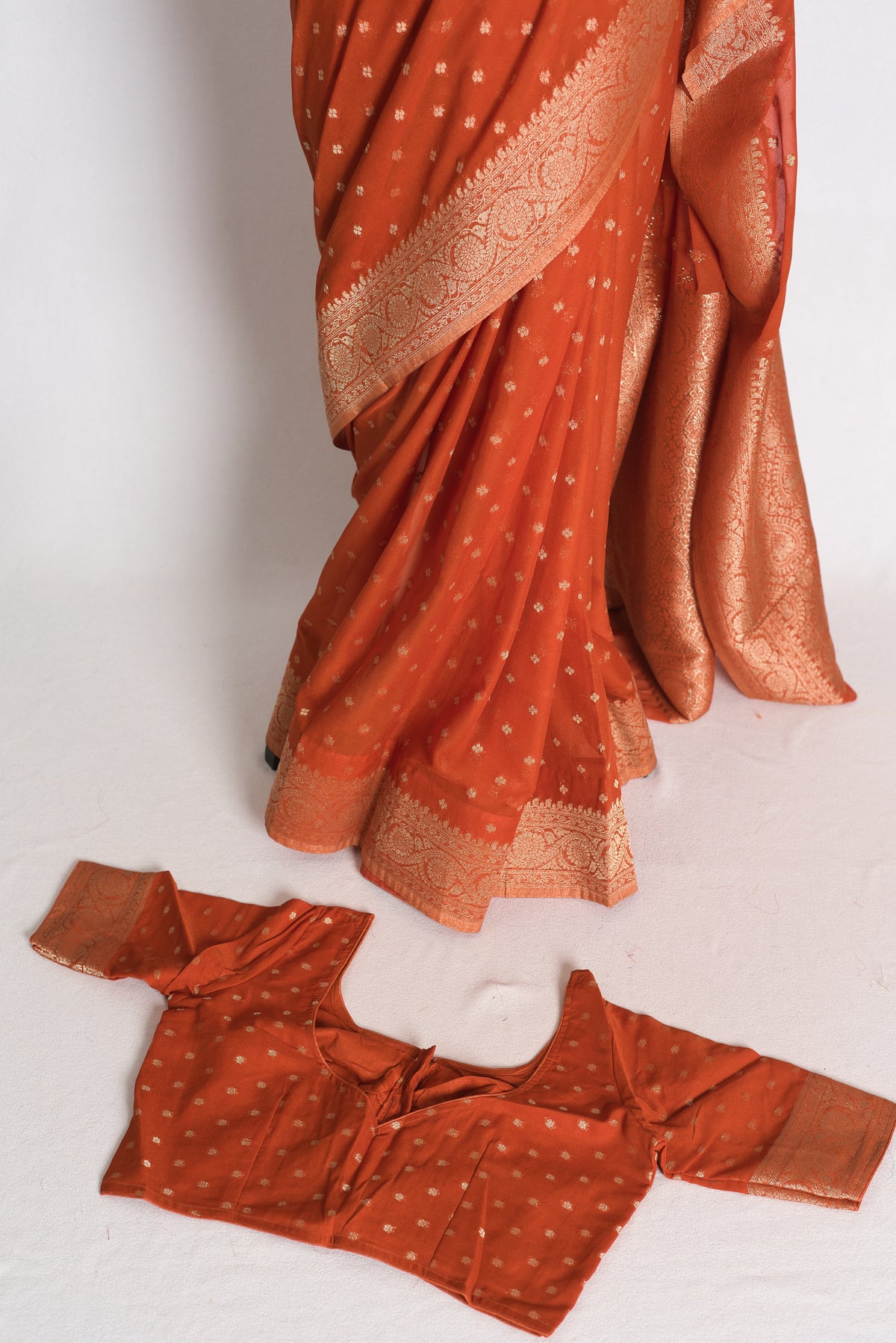 Mahi: Rust Brown Lightweight Semi Georgette Banarasi Saree with 38 Size Blouse