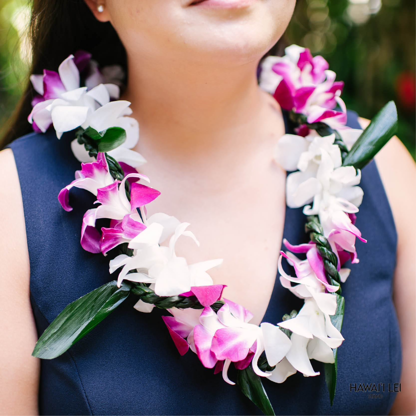 Orchid Wrapped With Ti Leaf Lei (Purple And White)