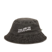 'YOU ARE ON NATIVE LAND' BUCKET HAT