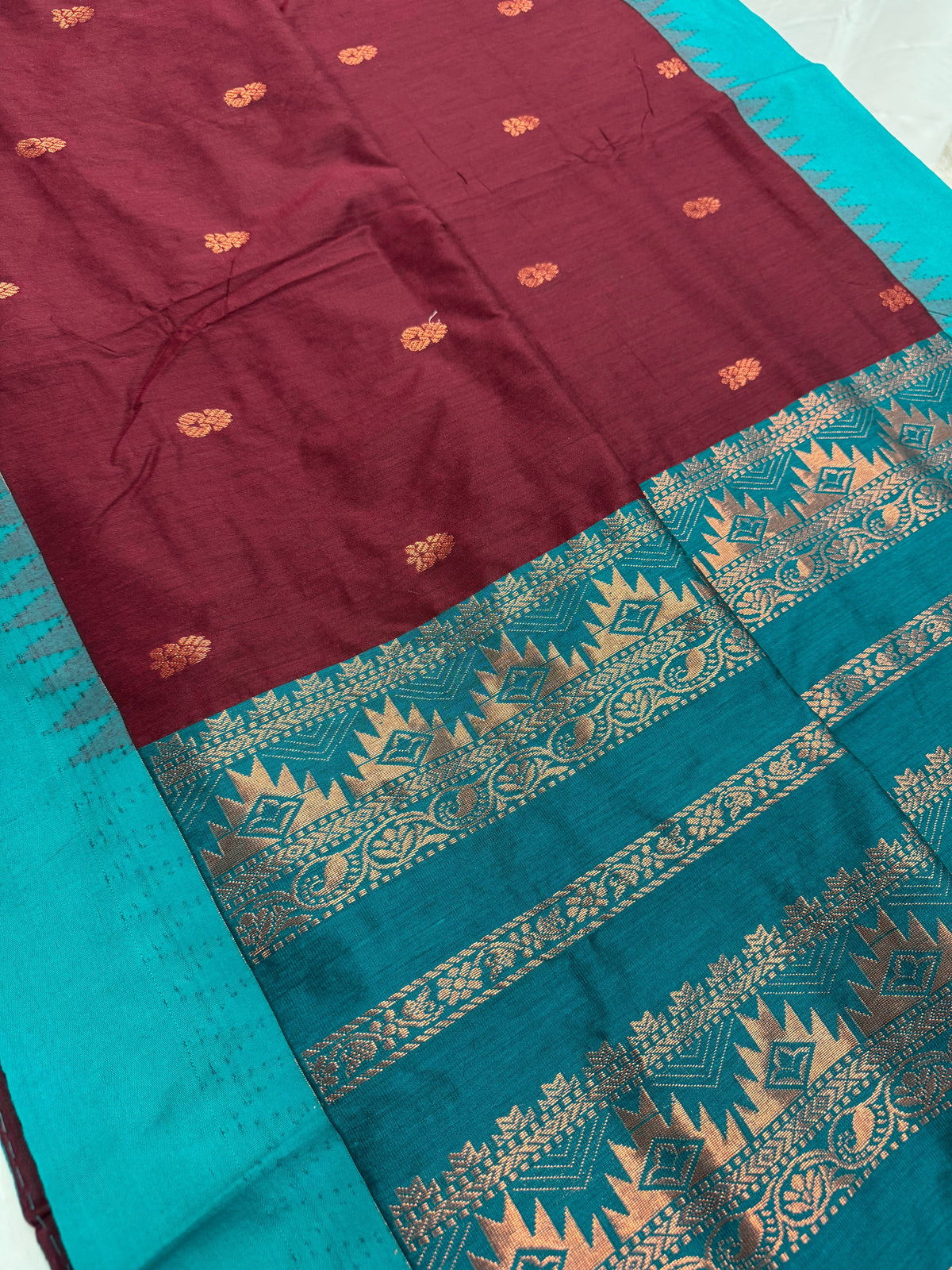 Pritha: Dark Brown and Sea Green Blended Cotton Gadwal Saree.