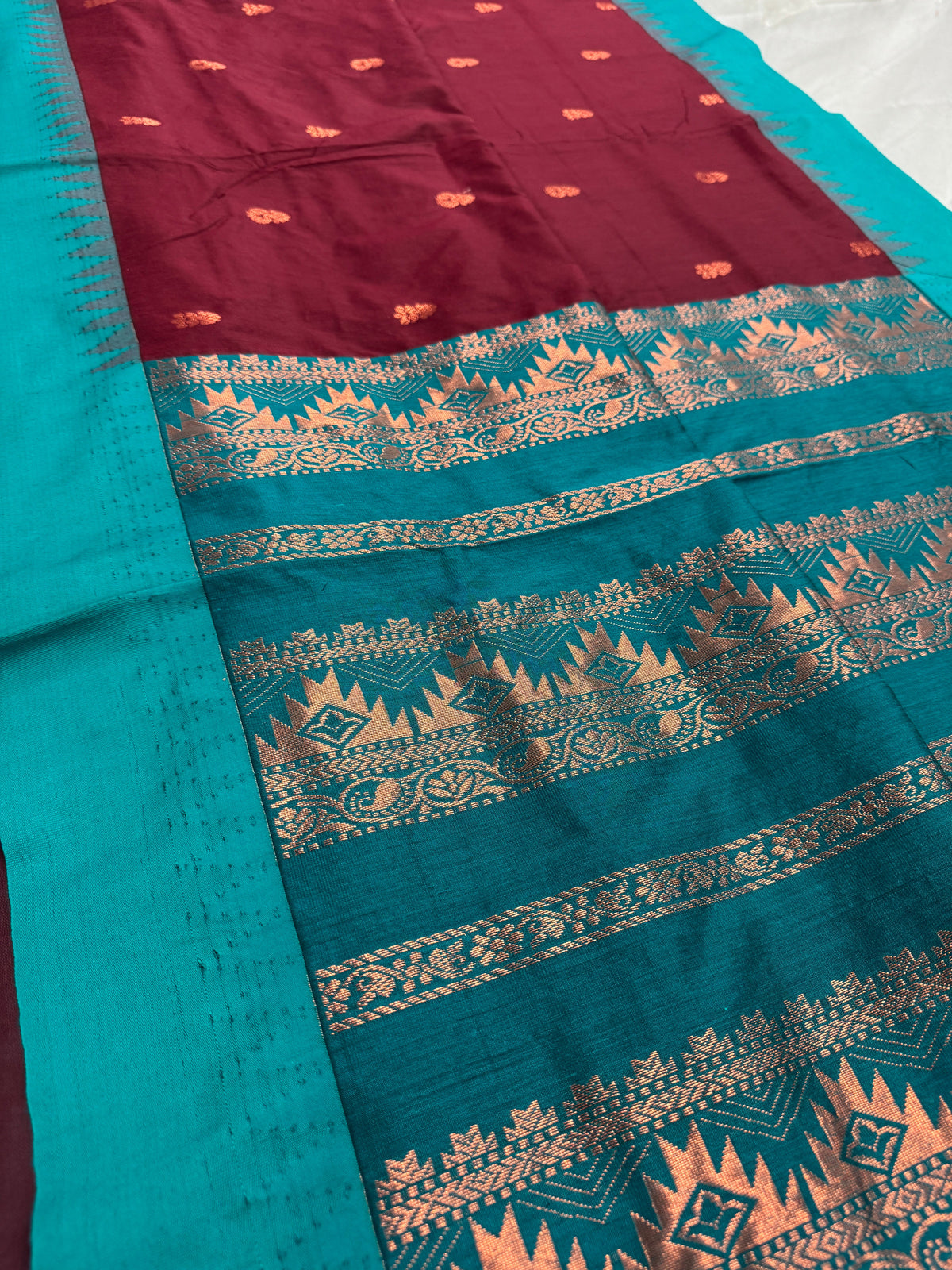 Pritha: Dark Brown and Sea Green Blended Cotton Gadwal Saree.