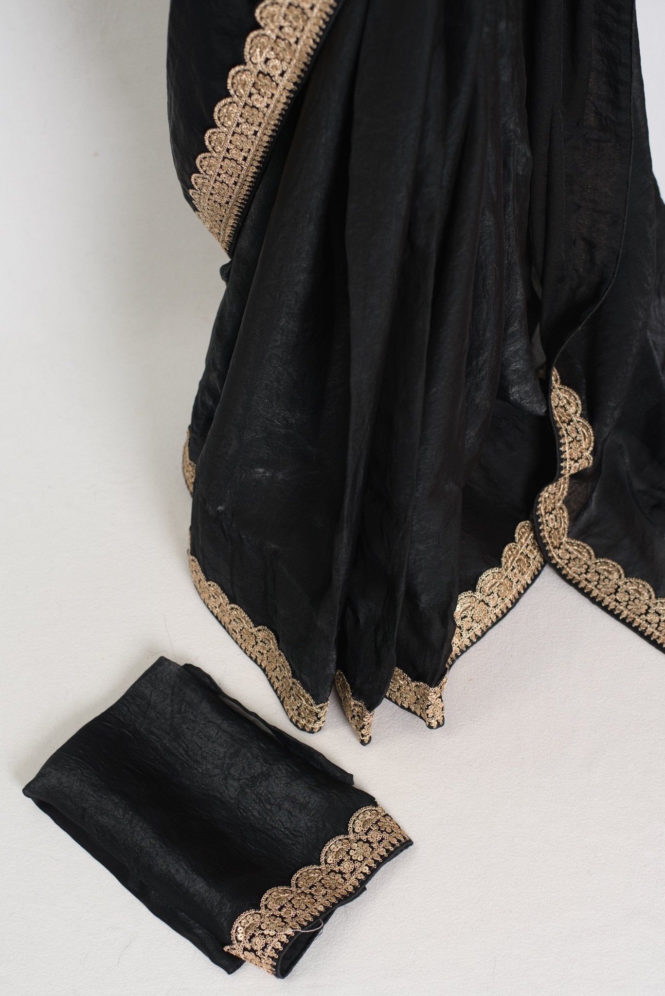 Farah : Designer Glass Tissue Black Partywear Saree with Patched Gold Border